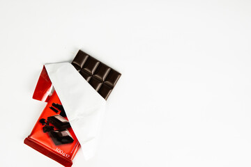 chocolate bar in the cover on a white background