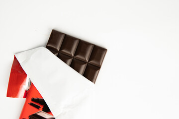 chocolate bar in the cover on a white background