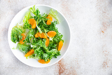 tangerine salad leaves green mix fresh citrus meal snack on the table copy space food background rustic. top view keto or paleo diet veggie vegan or vegetarian food no meat