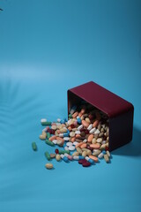 coronavirus pills on a blue background 