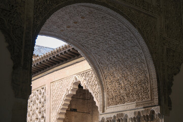 Patios, courtyards garden halls hallways colonnades frescoes tiles pillars in Moorish Arabian...