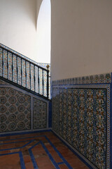 Patios, courtyards garden halls hallways colonnades frescoes tiles pillars in Moorish Arabian...