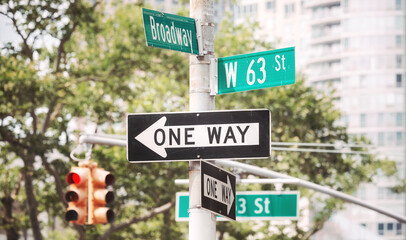 Traffic signs at Broadway road, color toning applied, New York City, USA.