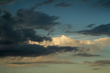 Fototapeta na wymiar Cloudscape. Beautiful blue sky with clouds at sunrise. 