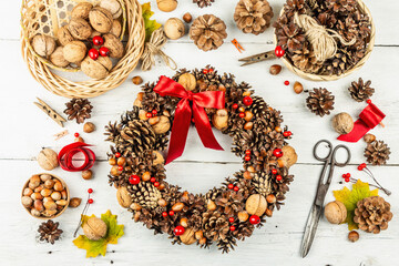Autumn wreath of cones, nuts, and berries. Assortment from natural materials