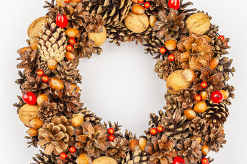 Autumn wreath of cones, nuts, and berries. Creative composition, the handmade
