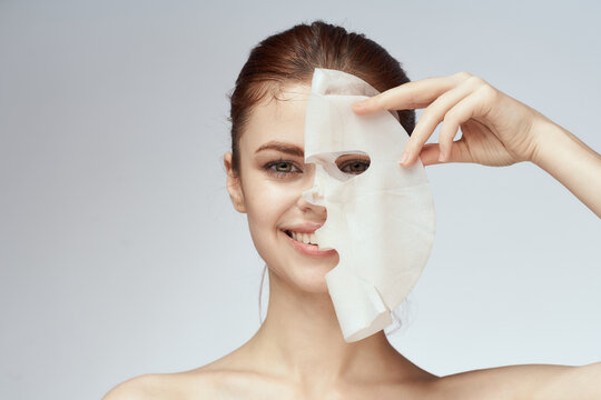 woman with bare shoulders face mask skin care procedures