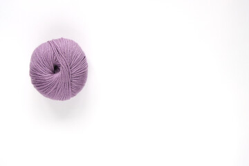 Ball of purple yarn. Isolated on white background.