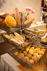 assorted bread basket on the buffet table