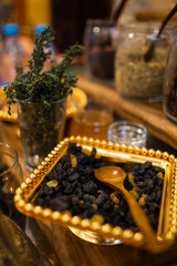 a plate of dried fruits with raisins on the table
