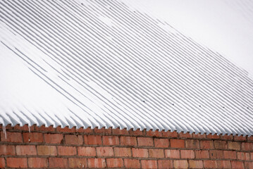 There is snow on the roof.