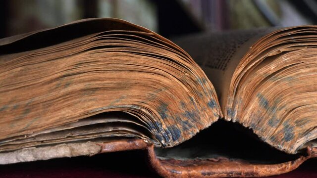 Old book on a wooden table

