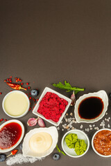 Set of different sauces - ketchup, mayonnaise, barbecue, soy, chutney, wasabi, adjika, horseradish
