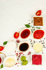 Set of different sauces - ketchup, mayonnaise, barbecue, soy, chutney, wasabi, adjika, horseradish