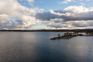 Lake Simco Barrie drone views of centennial park boatyard  around sunset with over class clouds 