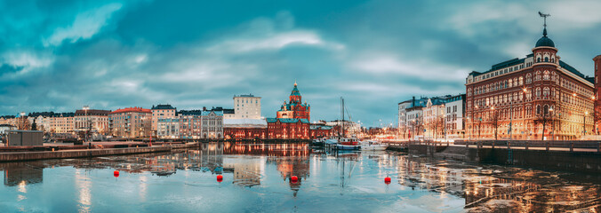 Helsinki, Finland. Panoramic View Of Pier, Embankment On Kanavaranta Street, Uspenski Cathedral And Pohjoisranta Street In Evening Illuminations