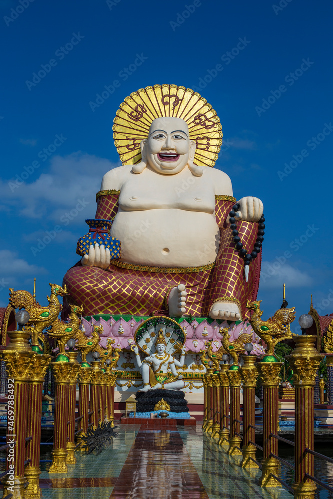 Wall mural smiling buddha of wealth statue on koh samui, thailand