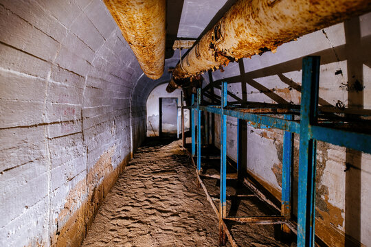 Old dark abandoned dirty Soviet bunker, echo of Cold War