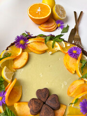 Naklejka na ściany i meble Cake with orange and mint, close up