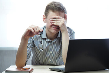 Online education. A university student remotely during the coronavirus pandemic. High quality photo
