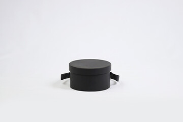Black empty template round gift cardboard packaging box with closed lid