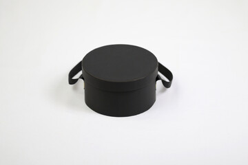 Black empty template round gift cardboard packaging box with closed lid