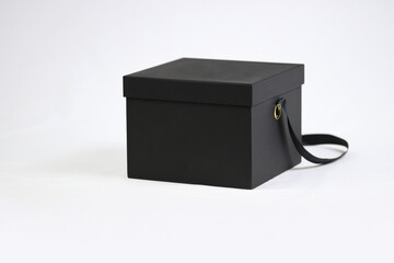 Black empty template square gift cardboard packaging box with closed lid