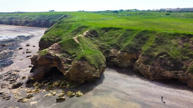Cliffs and beach at Blackhall Rocks and Cromdon Dene Beach