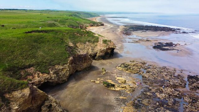 Cliffs and beach at Blackhall Rocks and Cromdon Dene Beach