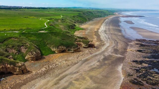 Cliffs and beach at Blackhall Rocks and Cromdon Dene Beach