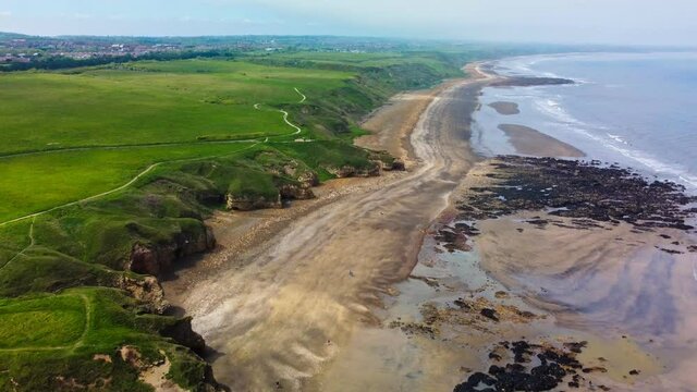 Cliffs and beach at Blackhall Rocks and Cromdon Dene Beach