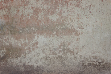 Beautiful old gray-brown concrete wall with crumbled cement 