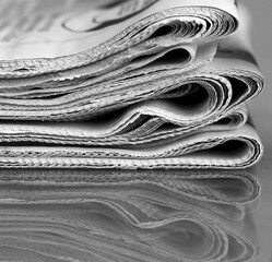 pile of newspaper with white background stock photo