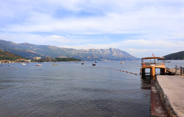 View of St. Nicholas Island and pier in Budva, Montenegro