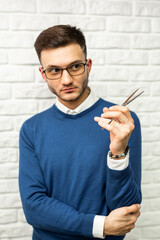 Professional barber hair stylist holds scissors 