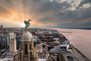 Aerial view of the Liver birds statue taken in the sunrise over Liverpool city in England.