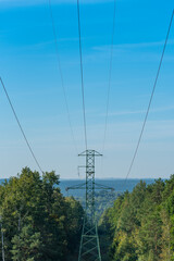 High voltage power line in the forest. Świętokrzyskie Mountains Poland.