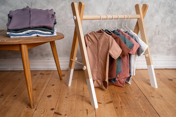 For a child from zero to two years old, colored on a hanger. Children's store sale of fashionable clothes. Comfortable pajamas and soft fabric for babies.