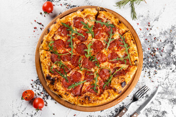 Traditional Italian pepperoni pizza. Top view with ingredients.