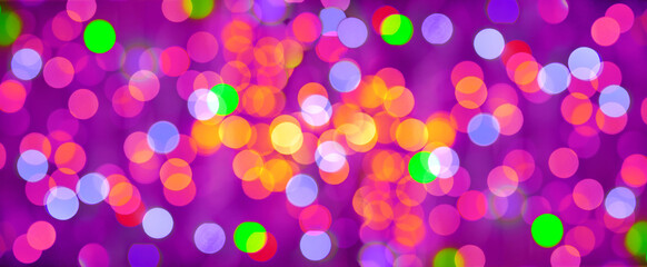 Lights of the festive background. Abstract, bright multicolored background, blurred bokeh, banner.