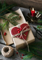 Romantic decorative gift box with homemade heart shape greeting card as a festive Christmas present...