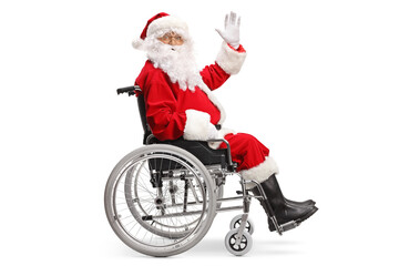 Full length profile shot of santa claus sitting in a wheelchair and waving at camera