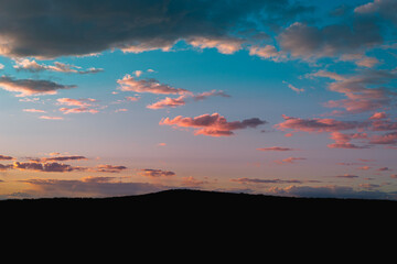 Fototapeta na wymiar Blue-red clouds in the evening sky.