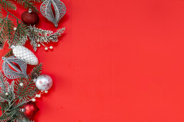 Christmas Decorations on a Red Background with Room for Copy