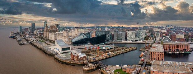 Beautiful panorama of Liverpool waterfront in the evening sunset. Liverpool aerial view. - obrazy, fototapety, plakaty