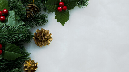 Obraz na płótnie Canvas Christmas decorations, pine tree leaves, balls, berries on snow white background, Christmas concept
