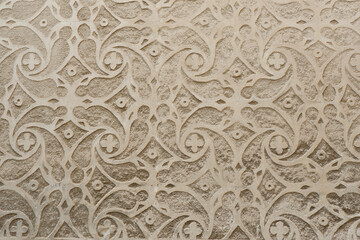 Floral finishing in sgraffito technique on building outside in Segovia, Spain. Oriental grey ornate.
