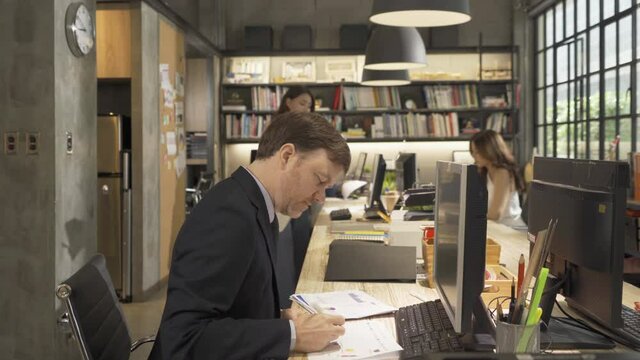 A group of multi ethnic business team talk, communicate, discuss, and work in meeting room in office, present ideas with a computer technology device to colleagues. People lifestyle. Corporation