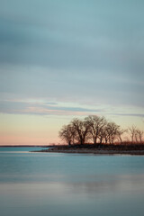 Obraz na płótnie Canvas Lake sunset with cove point.