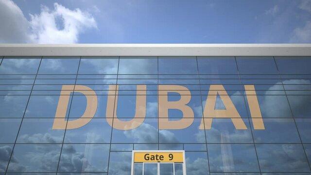 DUBAI text revealed with landing airplane on airport building